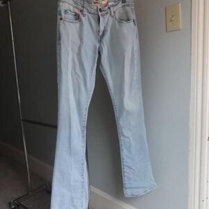 Light blue Levi's jeans with a boot cut leg 70s Throwback Groovy Glam